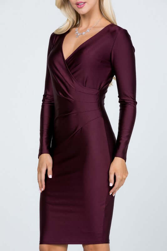 Long sleeve shiny tricot overlap midi dress in mermaid silhouette, solid color, with V-neckline and knee-length fit, perfect for parties.
