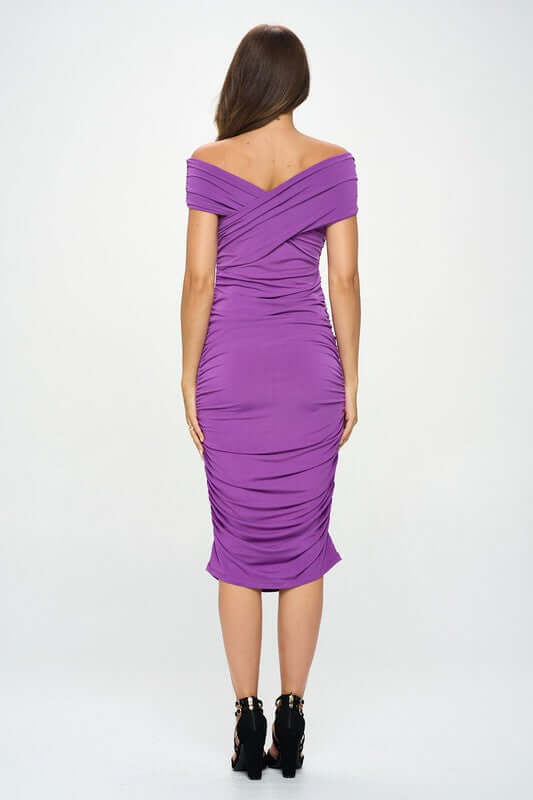 Purple solid off shoulder midi bodycon dress with ruched detail, knee-length, polyester and spandex fabric, back view.