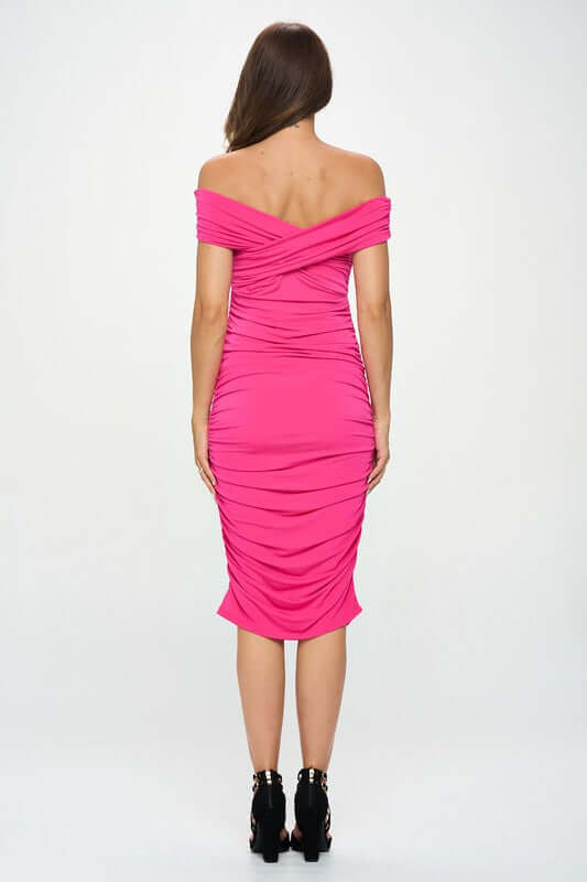 Solid pink off shoulder midi bodycon dress with ruched detail, knee-length, made in USA, polyester-spandex blend.