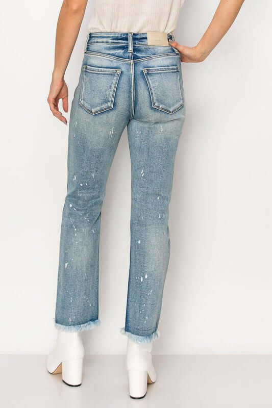 High Rise Distressed Straight Fray Hem Jeans in medium wash with back view and edgy style.