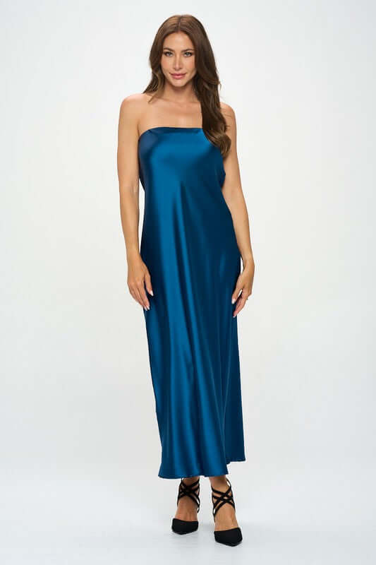 Woman wearing silky satin tube draped maxi dress in blue, sleeveless, made in USA, solid pattern