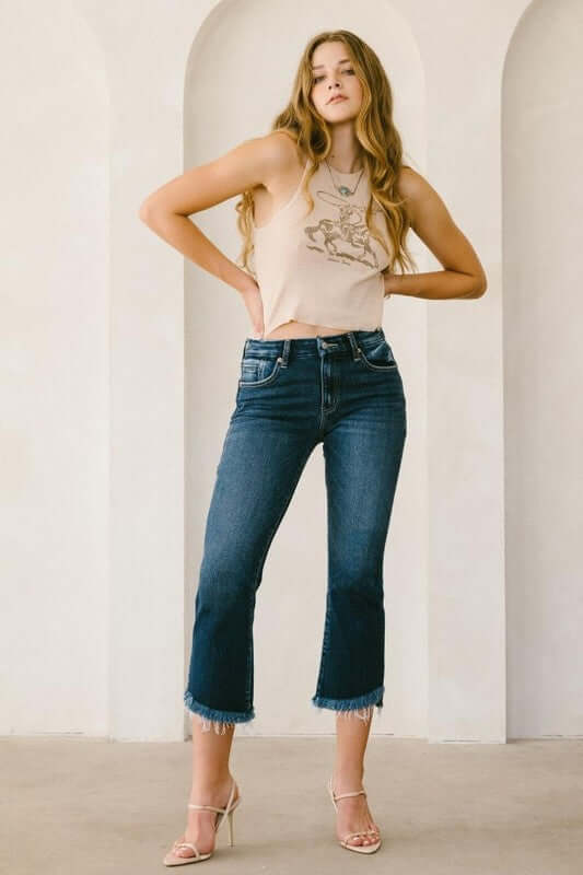 Woman wearing Corset High Rise Crop Flare Jeans with tummy control and corset support, showcasing a casual and flattering silhouette.