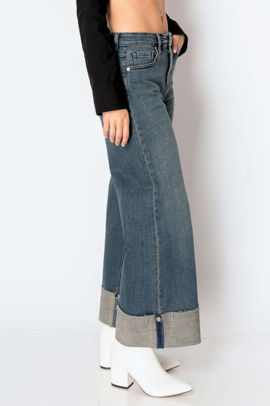 High rise wide leg jeans with tummy control, cuff detailing, and stretch denim for a flattering silhouette and comfortable fit.