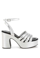 Metallic high platform sandals with strappy vamp and block heels, perfect for dressy occasions and stylish outfits.