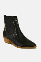 Stylish black studded point toe boots with a fashionable silhouette and bold embellishments.