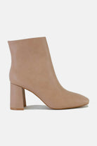 Stylish PU leather block heel boots in beige with a sleek design and comfortable side zippers for easy wear.