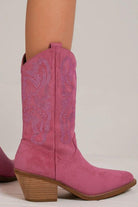 Pink point toe boots with rhinestone detail, featuring a chic design and stylish heel for elegant outfits.