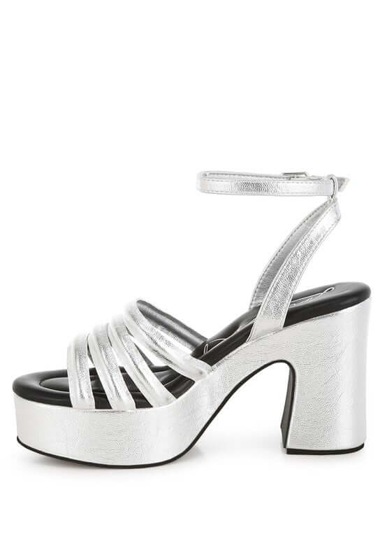 Metallic high platform sandals with strappy vamp and block heel, perfect for elevating any stylish outfit.